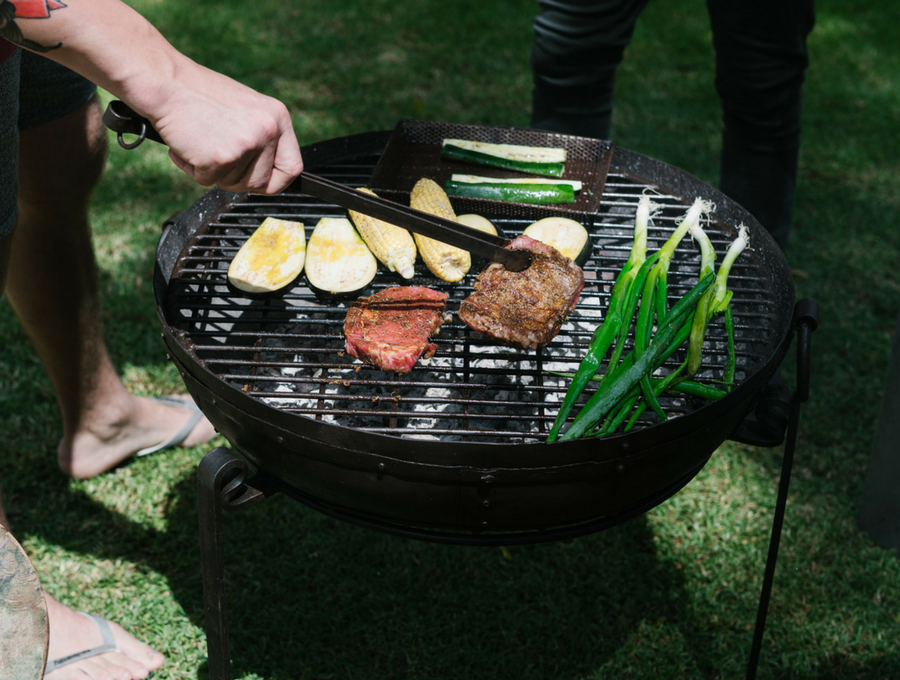 churrasco steak, zesty salsa verde, marinated jerk chicken and charcoal grilled vegetables cooking on Kadai Sticks and Stones Outdoor